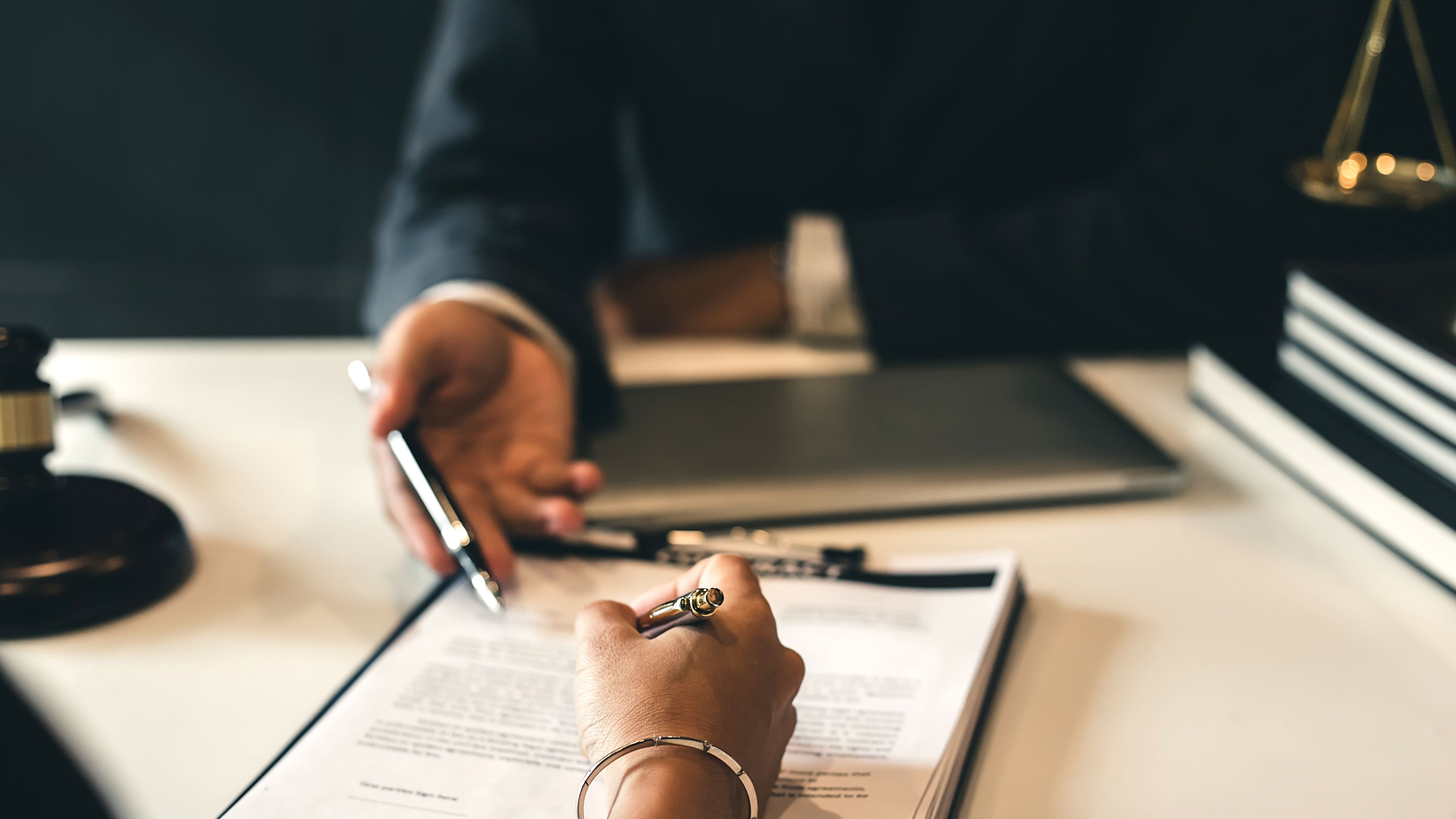 Business owners reviewing an agreement together