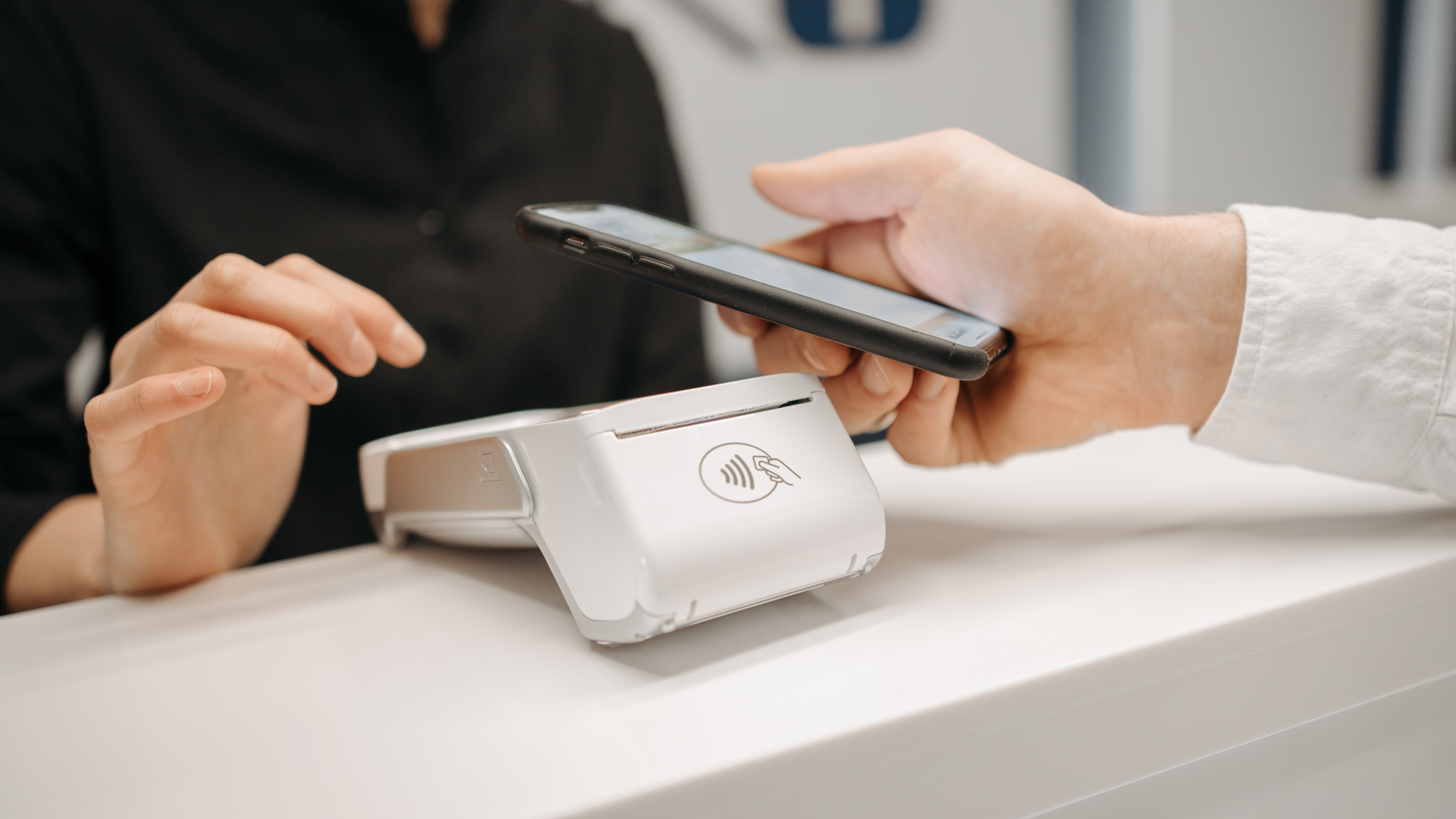 Customer completing a contactless payment